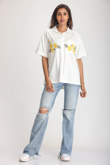SOLID COLOR FRONT EMBROIDERED BUTTON-UP SHIRT.